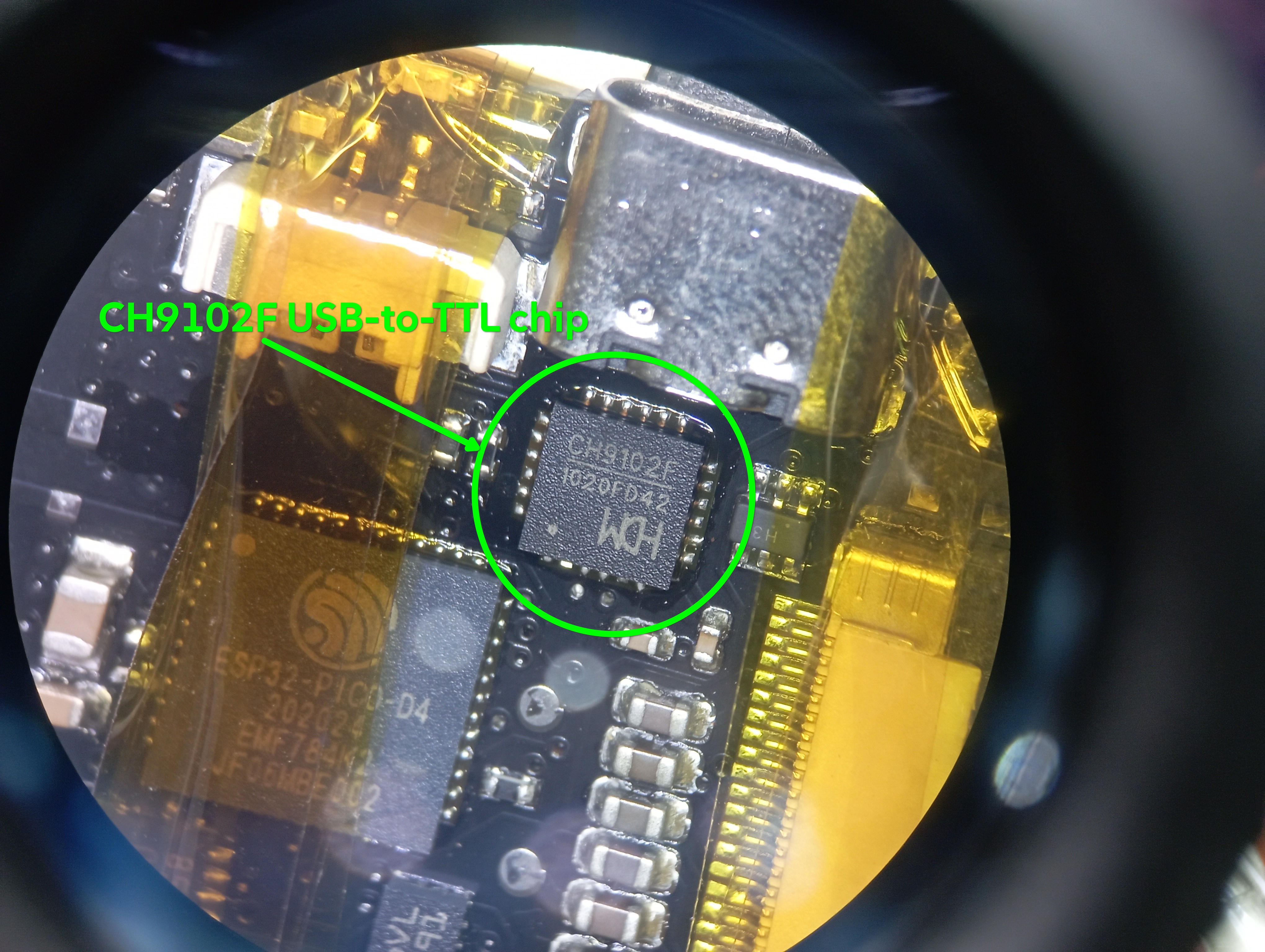The USB-to-TTL chip on a Watchy v2 clone (CH9102F) under a microscope